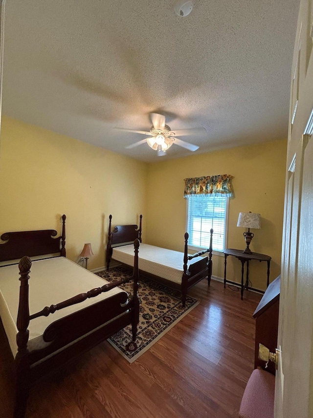 236 Chamblee Rd, Walterboro, SC 29488 - bedroom with wood finished floors, a textured ceiling, ceiling fan, and baseboards