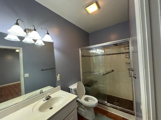 236 Chamblee Rd, Walterboro, SC 29488 - full bathroom featuring a shower stall, vanity, toilet, and a textured ceiling