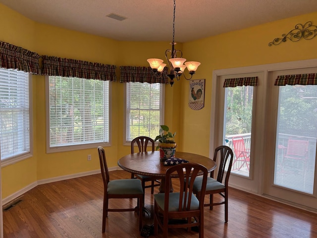 236 Chamblee Rd, Walterboro, SC 29488 - dining area with a chandelier, wood finished floors, and healthy amount of natural light