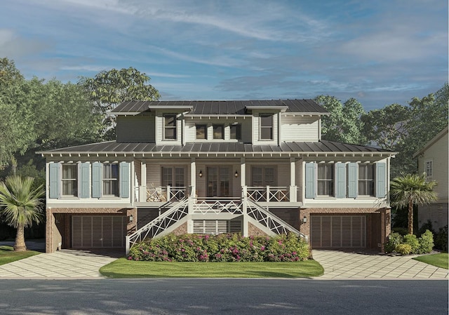 view of front of home featuring a porch and a garage