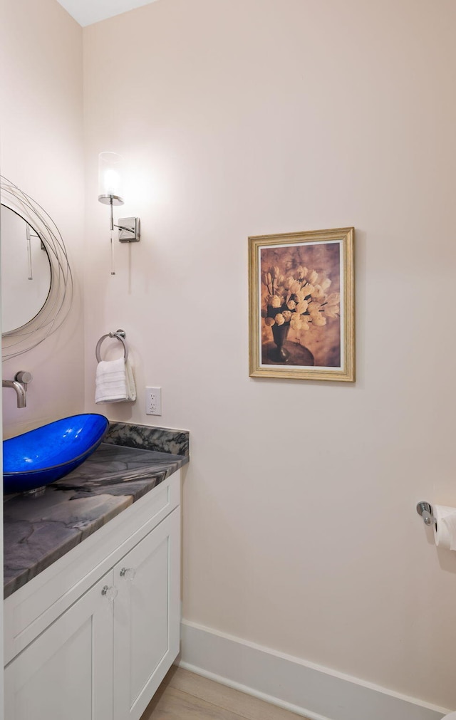 2213 Rolling Dune Rd, Seabrook Island, SC 29455 - bathroom featuring vanity, baseboards, and wood finished floors