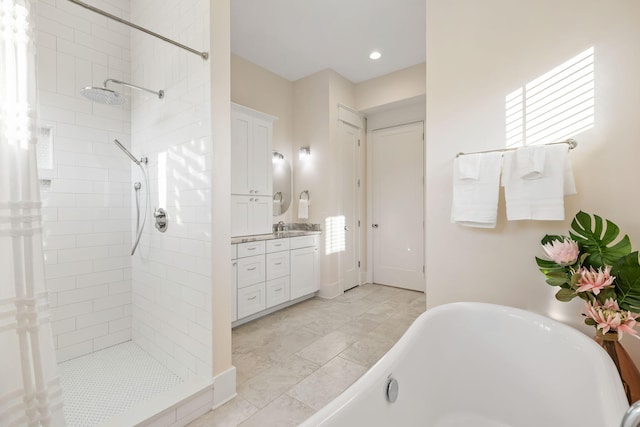 2213 Rolling Dune Rd, Seabrook Island, SC 29455 - full bathroom with a freestanding tub, tiled shower, vanity, recessed lighting, and baseboards