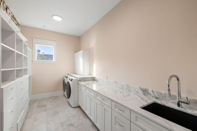 2213 Rolling Dune Rd, Seabrook Island, SC 29455 - laundry area featuring cabinet space, separate washer and dryer, and baseboards