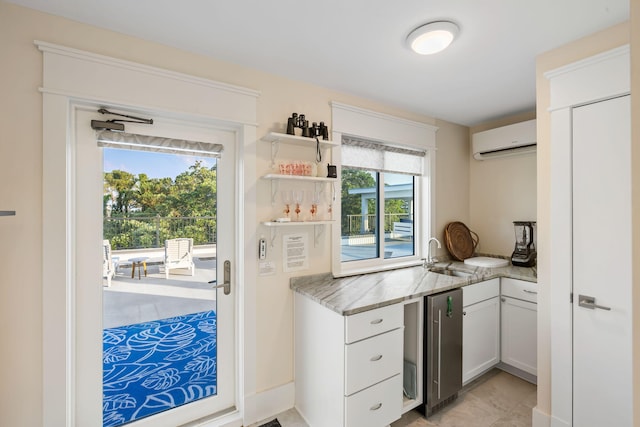 2213 Rolling Dune Rd, Seabrook Island, SC 29455 - kitchen with a sink, a wall mounted air conditioner, light stone counters, open shelves, and white cabinetry