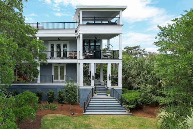 2213 Rolling Dune Rd, Seabrook Island, SC 29455 - view of front facade with french doors, a balcony, stairway, and a ceiling fan