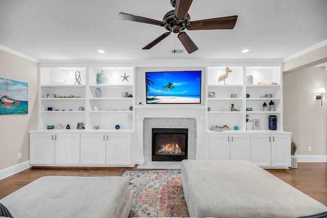5725 Caviar Ct, Johns Island, SC 29455 - living room with ornamental molding, baseboards, ceiling fan, wood finished floors, and a premium fireplace