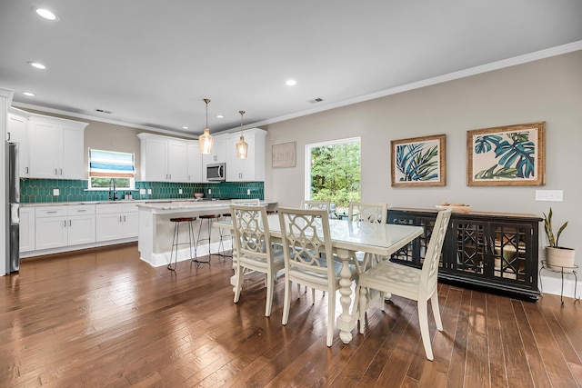 5725 Caviar Ct, Johns Island, SC 29455 - dining area featuring recessed lighting, dark wood-style floors, and ornamental molding