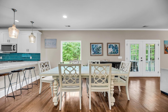 5725 Caviar Ct, Johns Island, SC 29455 - dining area featuring crown molding, wood finished floors, recessed lighting, and french doors