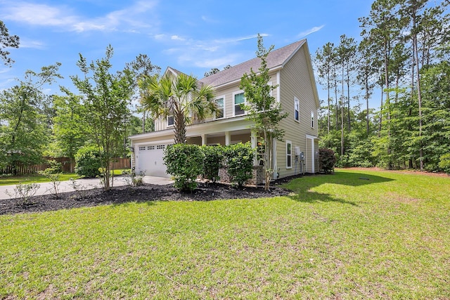 5725 Caviar Ct, Johns Island, SC 29455 - view of home's exterior with driveway, a lawn, and a garage