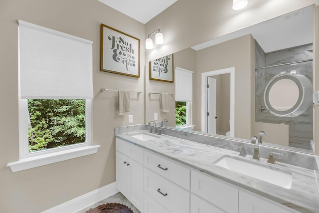 5725 Caviar Ct, Johns Island, SC 29455 - full bathroom with double vanity, baseboards, plenty of natural light, and a shower with shower door