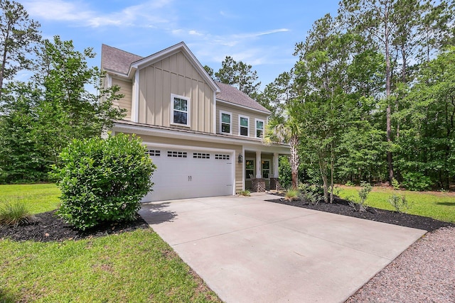 5725 Caviar Ct, Johns Island, SC 29455 - craftsman-style house featuring board and batten siding, concrete driveway, an attached garage, a front lawn, and a shingled roof