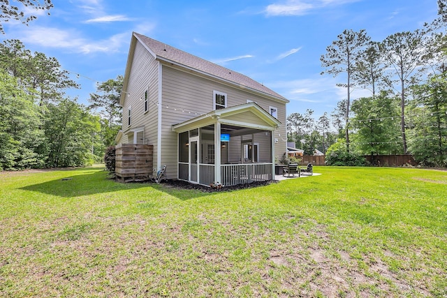 5725 Caviar Ct, Johns Island, SC 29455 - back of house with a sunroom, a patio, and a shingled roof