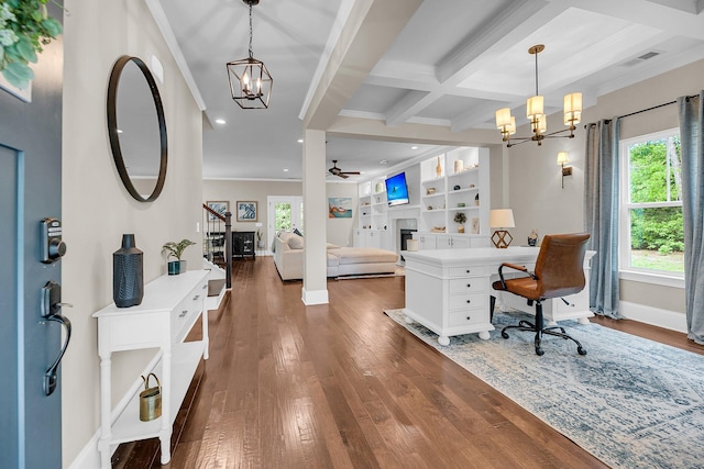 5725 Caviar Ct, Johns Island, SC 29455 - office space featuring a chandelier, ornamental molding, dark wood-type flooring, beamed ceiling, and a fireplace