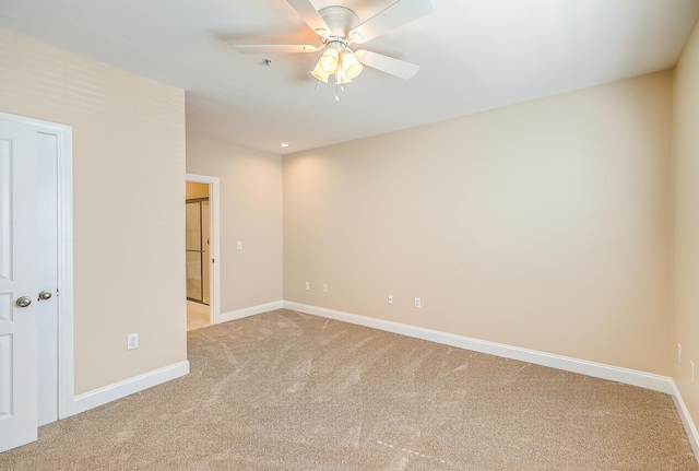 carpeted empty room with ceiling fan