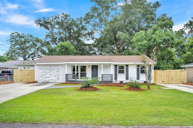 single story home with a front lawn and covered porch