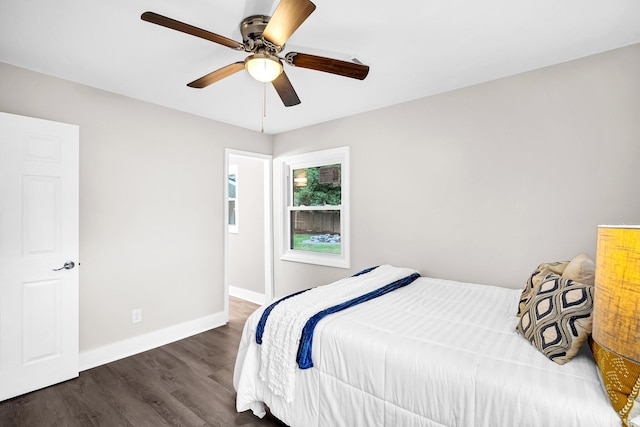 bedroom featuring dark hardwood / wood-style floors and ceiling fan