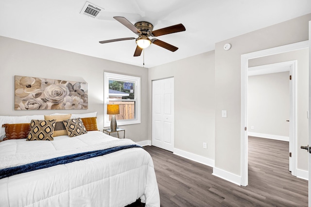 bedroom featuring a closet, ceiling fan, and dark wood-type flooring