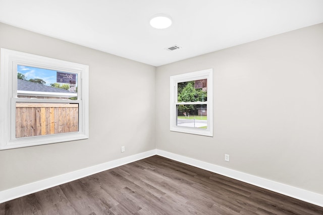 empty room featuring wood-type flooring