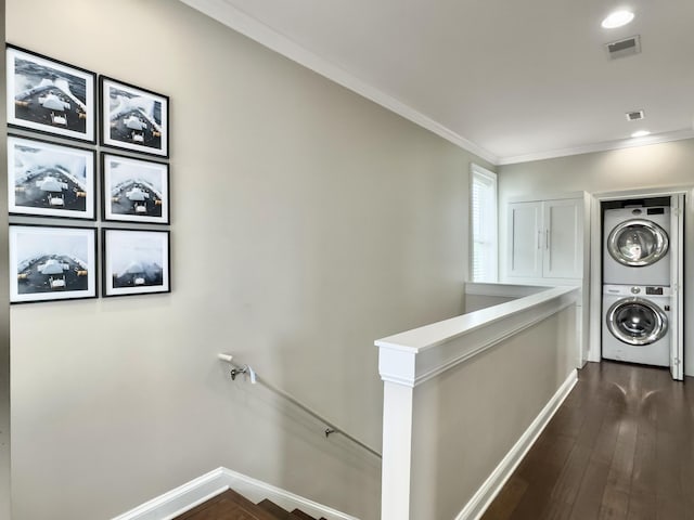 4 Line St, Charleston, SC 29403 - laundry room with stacked washing machine and dryer, ornamental molding, and dark wood-style flooring