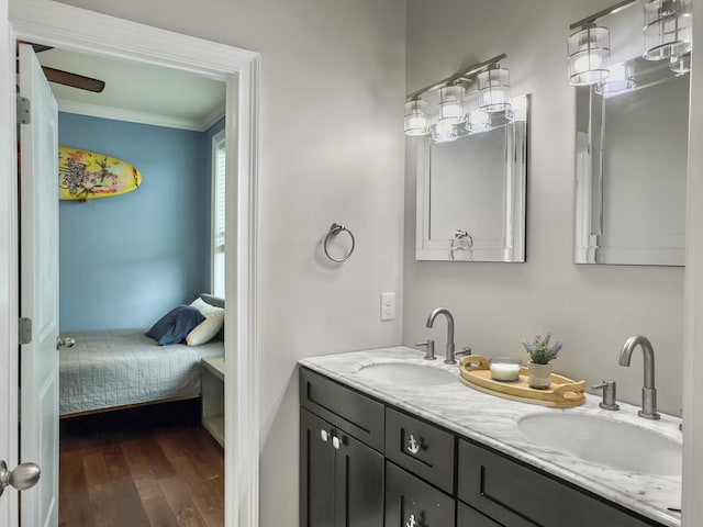 4 Line St, Charleston, SC 29403 - bathroom with crown molding, double vanity, connected bathroom, and wood finished floors