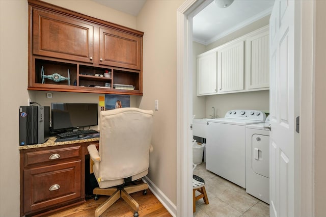 home office with baseboards, ornamental molding, separate washer and dryer, and built in desk