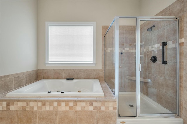 full bath featuring a whirlpool tub and a stall shower