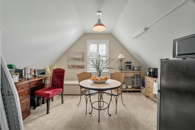 office with lofted ceiling and light colored carpet