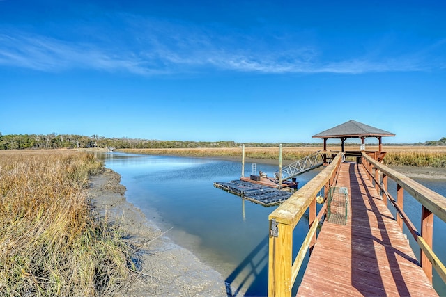 dock area featuring a gazebo and a water view