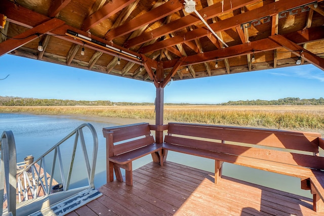 dock area with a water view, a gazebo, and a rural view