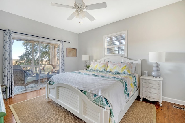 bedroom with hardwood / wood-style floors, access to exterior, and ceiling fan