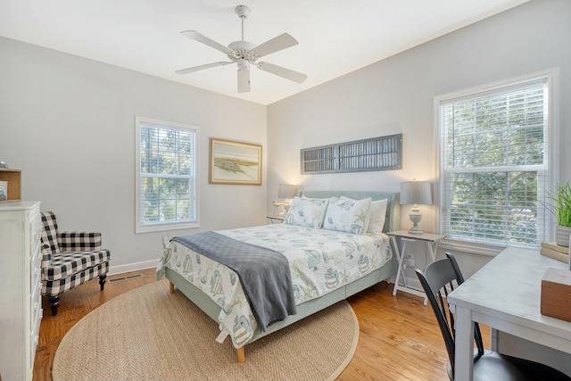 bedroom featuring light hardwood / wood-style floors and ceiling fan