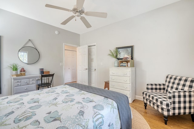 bedroom featuring light hardwood / wood-style flooring and ceiling fan