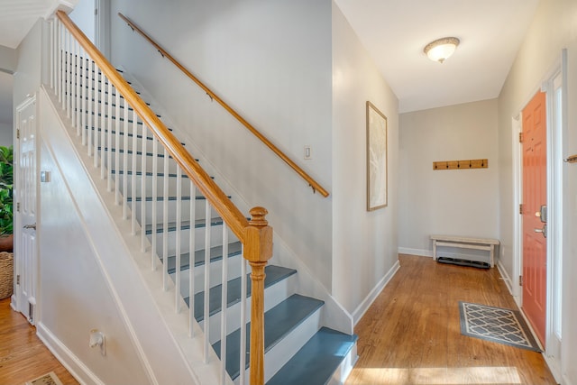 stairway featuring hardwood / wood-style floors