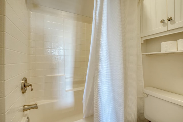 bathroom with toilet and shower / tub combo