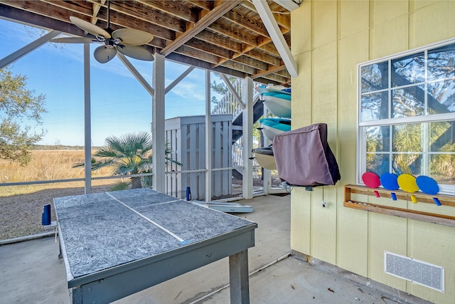 view of patio featuring ceiling fan