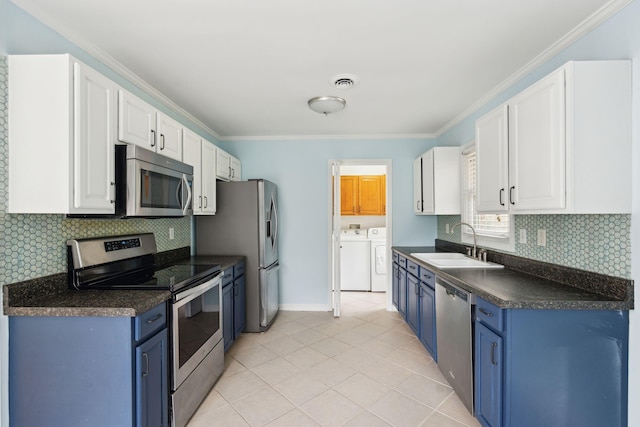 kitchen with stainless steel appliances, white cabinetry, and blue cabinetry