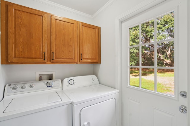 clothes washing area with cabinet space, crown molding, and separate washer and dryer