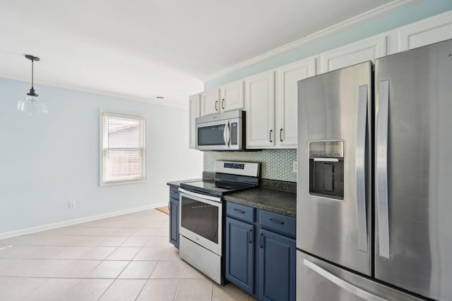 kitchen with tasteful backsplash, white cabinets, dark countertops, stainless steel appliances, and blue cabinetry