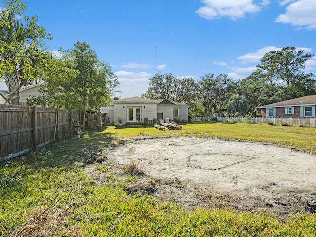 view of yard featuring french doors