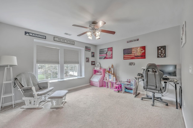 rec room with carpet and ceiling fan