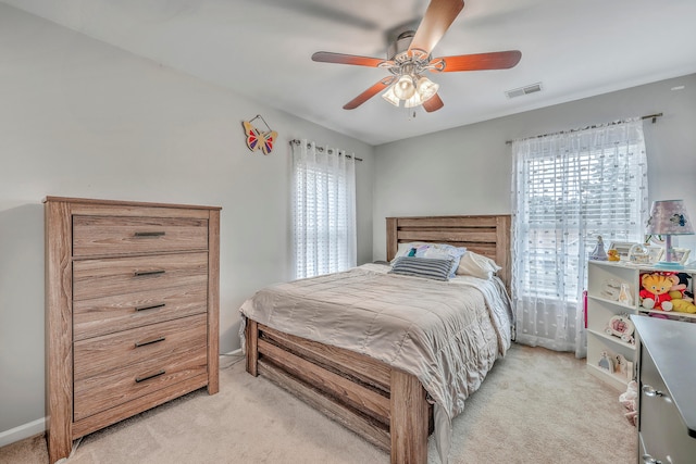 carpeted bedroom with ceiling fan