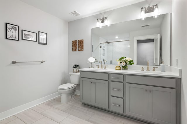 411 Katies Scenic Ct, Wando, SC 29492 - full bath featuring a stall shower, toilet, double vanity, and baseboards