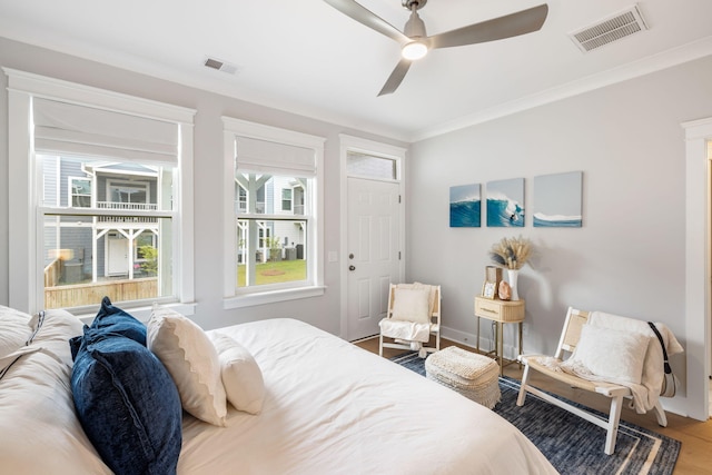 411 Katies Scenic Ct, Wando, SC 29492 - bedroom with wood finished floors, crown molding, ceiling fan, and baseboards