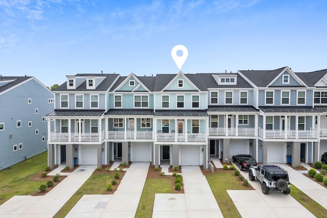 411 Katies Scenic Ct, Wando, SC 29492 - view of property featuring a standing seam roof, driveway, and a residential view