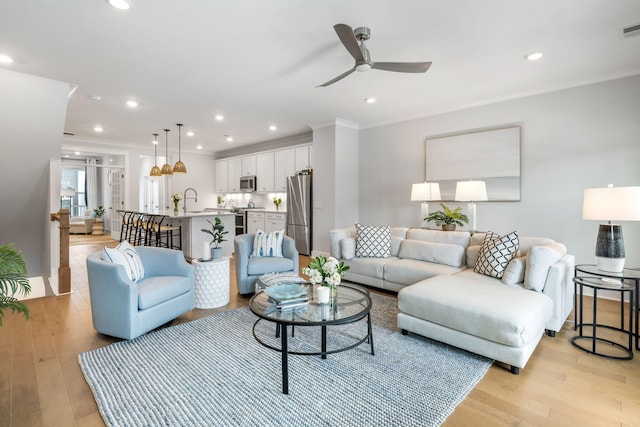 411 Katies Scenic Ct, Wando, SC 29492 - living area featuring ceiling fan, light wood-type flooring, recessed lighting, and crown molding