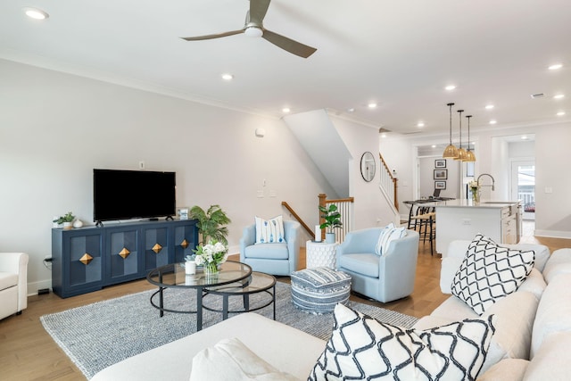 411 Katies Scenic Ct, Wando, SC 29492 - living area with ornamental molding, ceiling fan, recessed lighting, baseboards, and light wood-style floors