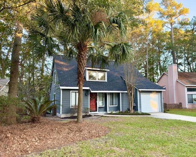 view of front facade featuring a front yard and a garage