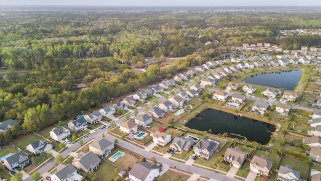 1529 Fishbone Dr, Johns Island, SC 29455 - aerial view of property's location featuring a heavily wooded area, nearby suburban area, and a large body of water