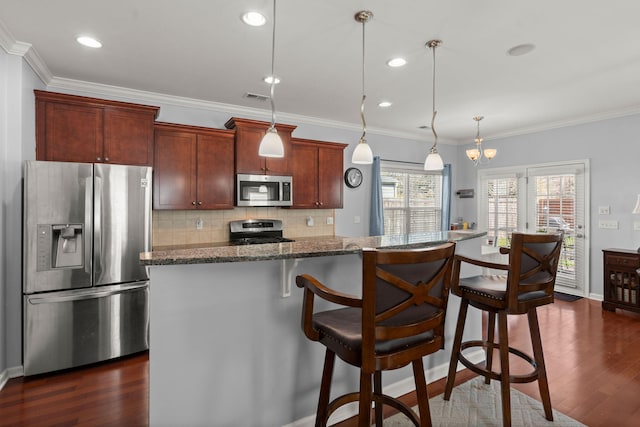 kitchen featuring visible vents, backsplash, dark wood-style floors, appliances with stainless steel finishes, and crown molding