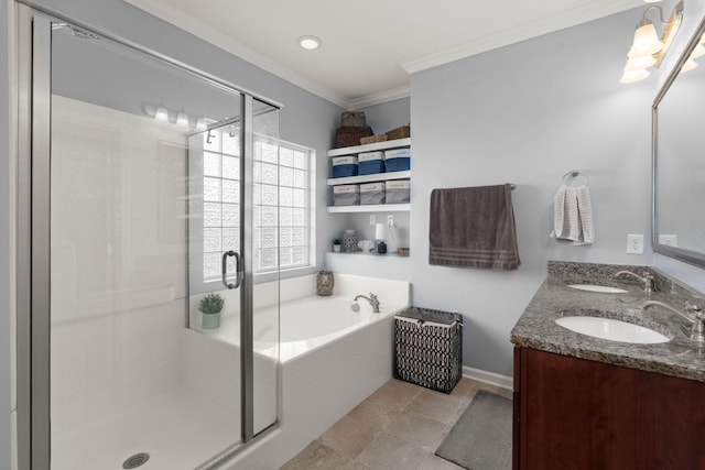 bathroom featuring a sink, a shower stall, a bath, and ornamental molding